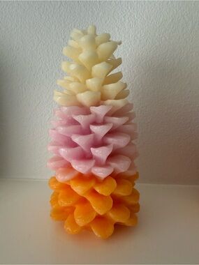 Anthropologie ombre pinecone decorative candle in cream, pink, orange